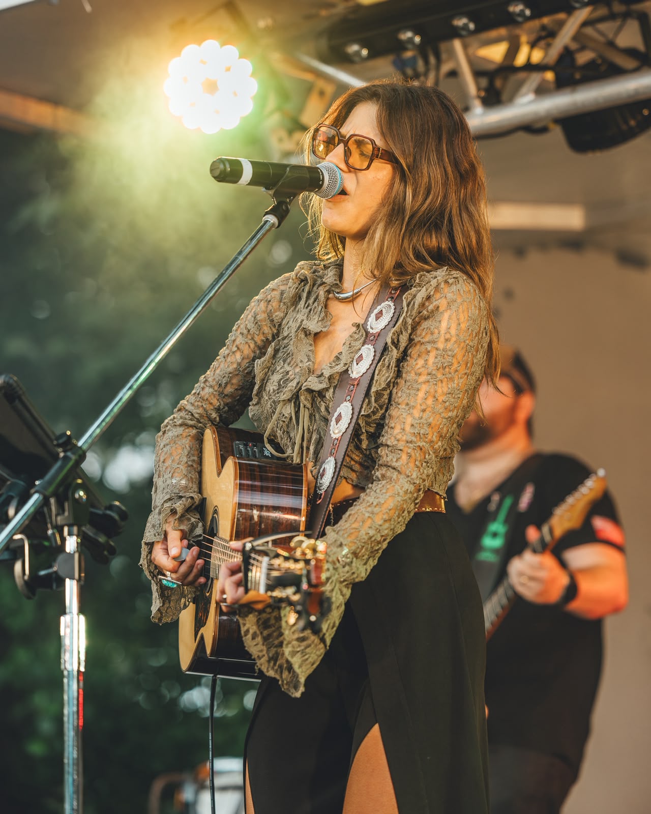 Bianca singing live with her guitar
